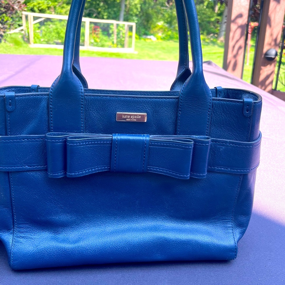 Kate Spade Tote medium sized with bow detail on front in navy leather.